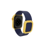 Back view of Apple Watch with gold casing and blue strap showing sensor detailing