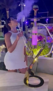 Premium hookah setup with gold customized shisha used in a luxury lifestyle setting