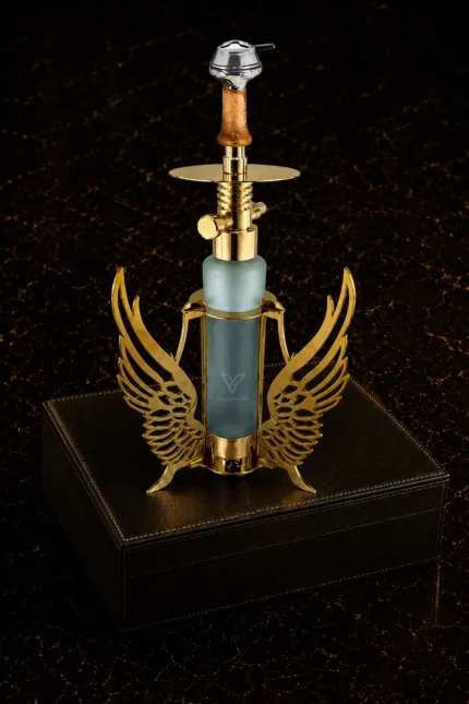Seraph Gold Shisha by GoldPrivé on a black leather box, gold wings around the frosted glass base below the wooden stem and plated tray