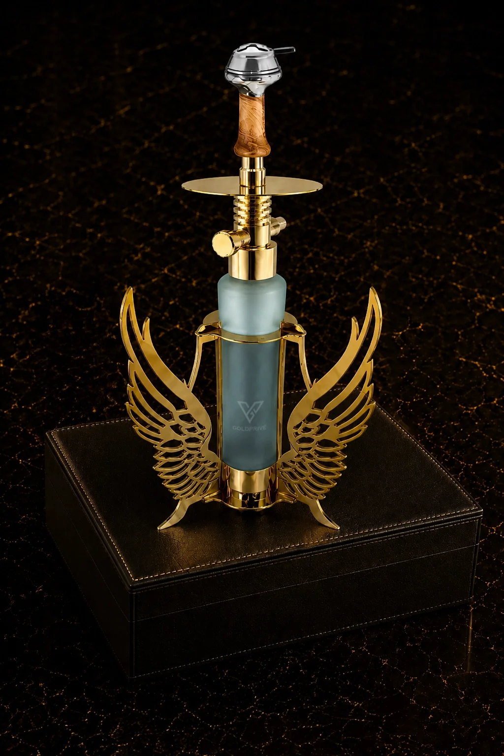 Sheesha_01 (1) Seraph Gold Shisha by GoldPrivé on a black leather box, gold wings around the frosted glass base below the wooden stem and plated tray