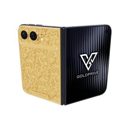 Botanica Gold iPhone Duo opened flat with baroque floral engraving across the gold back plate