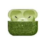 Chrysolite Swarovski AirPods Pro 3 open, pale green earbuds resting in a pale green interior, the case set in light olive-green crystals